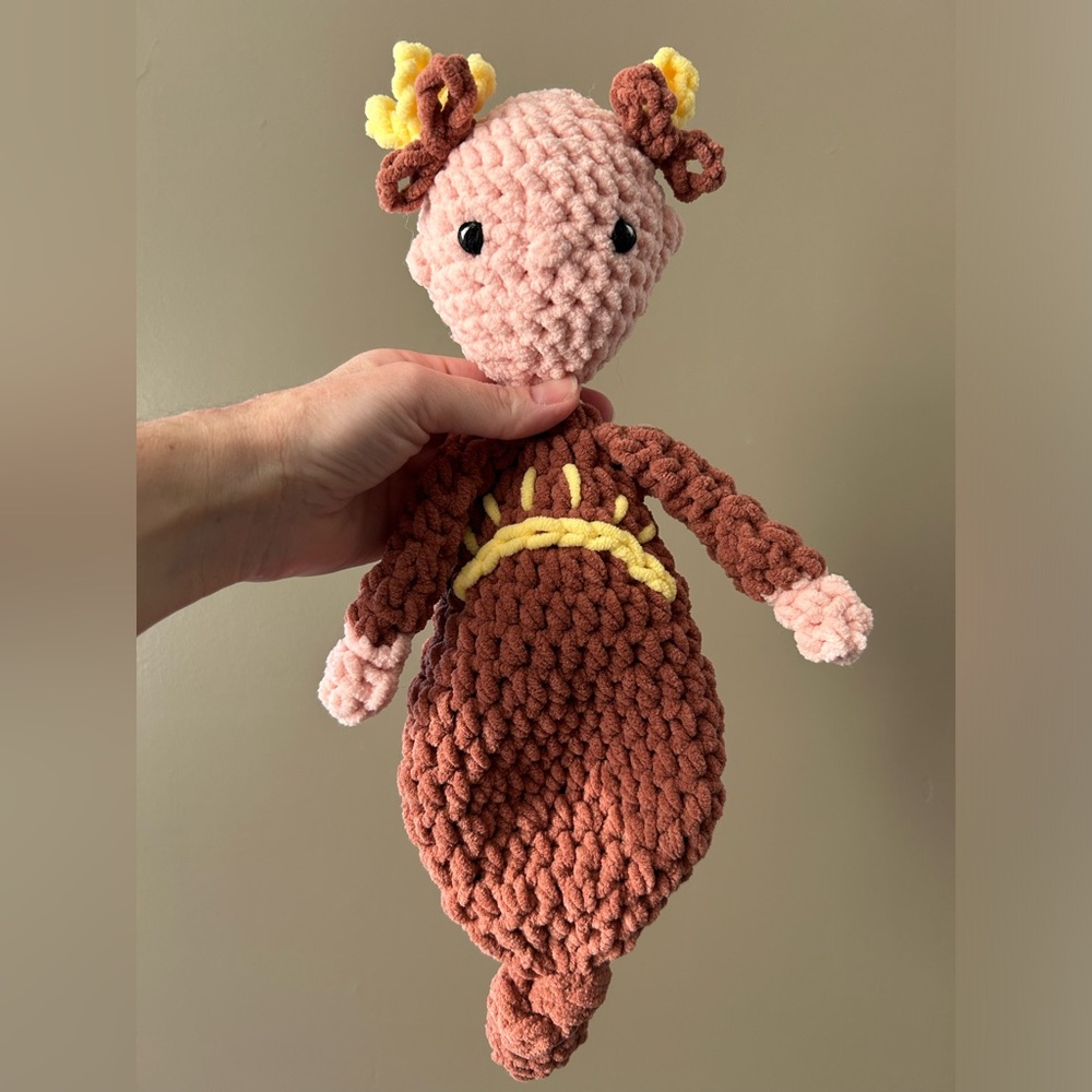 Handcrafted crochet doll with knotted gown